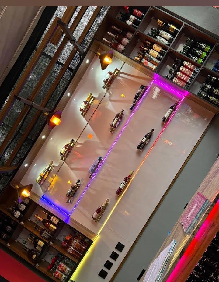 The illuminated bar wall at Josh Kabana Bar & Lounge